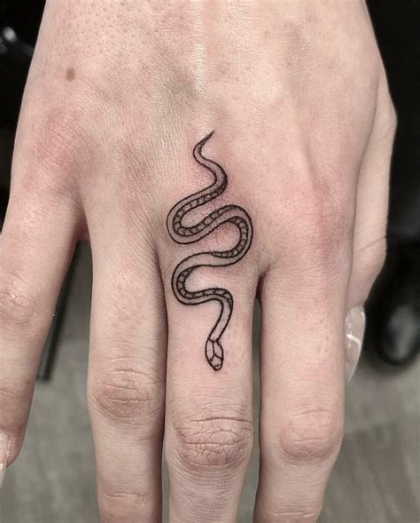 snake finger tattoo meaning.